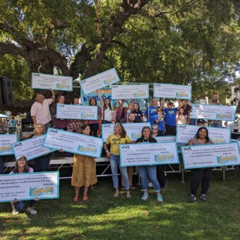 Photo of 2023 recipients of Chalk It Up grants holding oversized grant checks.